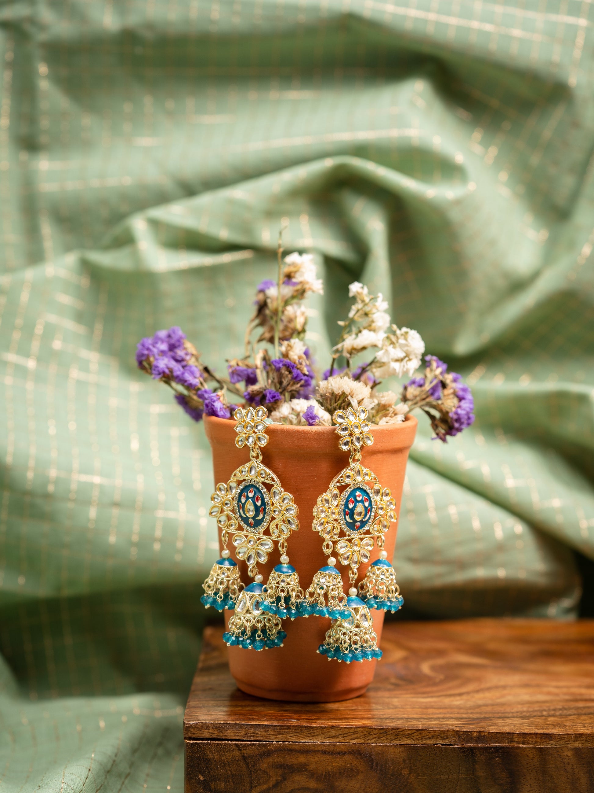 Sapphire Tier triple-tier jhumka earrings with blue meena and teal bead clusters, by Luxani