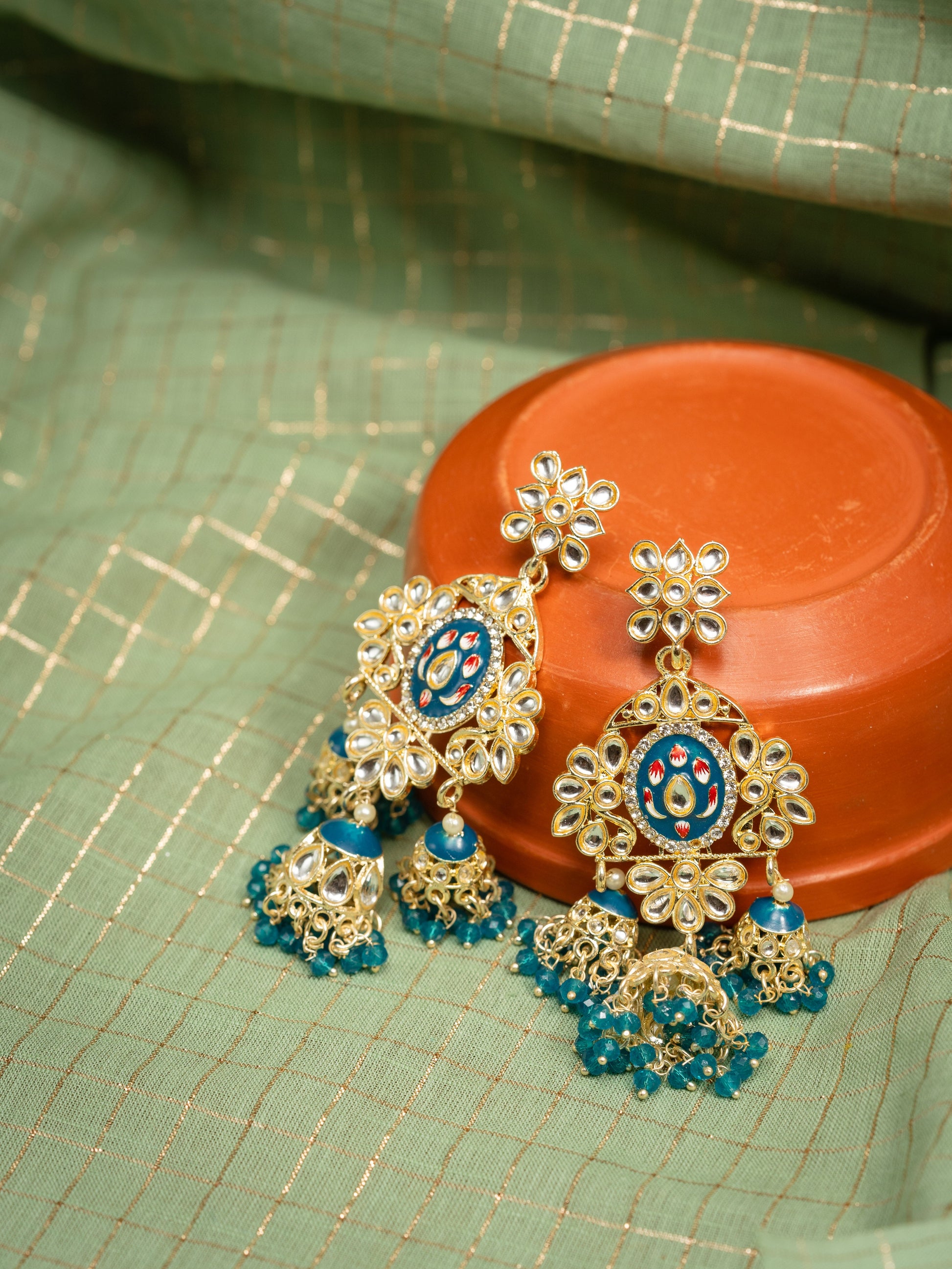 Sapphire Tier triple-tier jhumka earrings with blue meena and teal bead clusters, by Luxani
